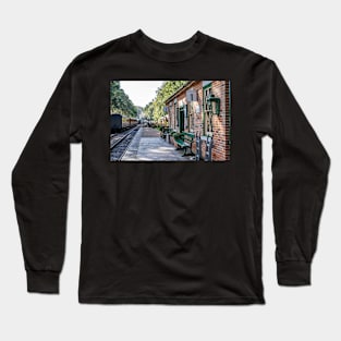 An empty Holt train station on the Poppy Line railway Long Sleeve T-Shirt